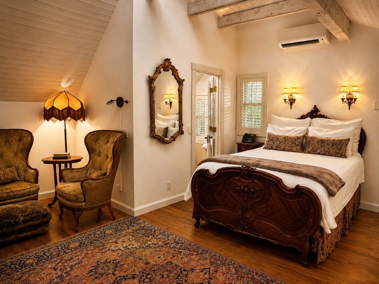 The carved queen bed in Greenwich Cottage